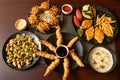 Garlic Mushroom, Vegetables Pakora, Prawn Tempura, Grilled Fish, swatted vegetables, chilli and soy sauce, mayo dip served in dish Royalty Free Stock Photo