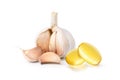 Garlic oil capsules with garlic bulb Royalty Free Stock Photo