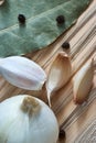 Garlic, onion, bay leaf, black pepper on a wooden table. Food background. Garlics. sliced garlic, garlic clove, garlic bulb.