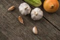 Garlic, onion, cucumber, potatoes and tomato on an old table Royalty Free Stock Photo