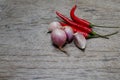 Garlic, onion and peppers for cooking. Put on the wood floor in Royalty Free Stock Photo