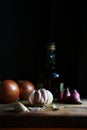 Garlic, onion and shallot on a cutting board Royalty Free Stock Photo