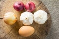 Garlic,onion,shallot,egg on cutting board Royalty Free Stock Photo