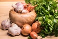 Garlic onion shallot parsley with pestle and olive wood mortar Royalty Free Stock Photo