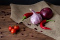 Garlic, onions, chili peppers and cherry tomatoes. Royalty Free Stock Photo