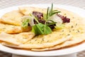 Garlic pita bread pizza with salad on top