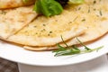 Garlic pita bread pizza with salad on top