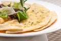 Garlic pita bread pizza with salad on top