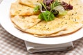 Garlic pita bread pizza with salad on top