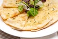 Garlic pita bread pizza with salad on top