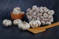 Garlic is placed on the black table in the kitchen, preparing for cooking Royalty Free Stock Photo