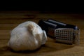Garlic with press Royalty Free Stock Photo