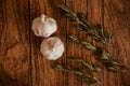 Garlic and rosemary wood background close-up table top Royalty Free Stock Photo