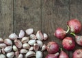 Garlic and shallot on Brown wood texture background. Royalty Free Stock Photo