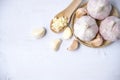 Garlic, sliced garlic, garlic bulbs with garlic cloves in  basket place  on white color vintage wooden  background.Top view Royalty Free Stock Photo