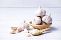 01Garlic, sliced garlic, garlic bulbs with garlic cloves in  basket place  on white color vintage wooden  background Royalty Free Stock Photo