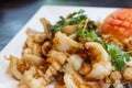 Garlic squid. Seafood in Thai restaurant. Royalty Free Stock Photo