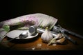 Garlic. Still life with garlic against a background of a garlic press Royalty Free Stock Photo
