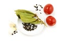 Garlic, tomato, peppercorn and bay leaf Royalty Free Stock Photo