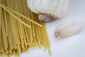 Garlic and Uncooked Spaghetti Close Up Royalty Free Stock Photo