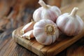 Garlic whole and sliced on a wooden table. Antibacterial, boosts immunity