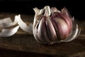 Garlic on wooden cutting table and dark background