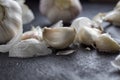 Garlic on wooden background black.