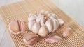 garlic bulbs and cloves on bamboo mat closeup Royalty Free Stock Photo