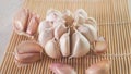 garlic cloves on a bamboo mat, close-up view Royalty Free Stock Photo