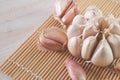 garlic cloves resting on a bamboo sushi mat Royalty Free Stock Photo