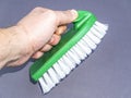 Garment brush with white bristles in hand Royalty Free Stock Photo