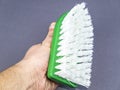 Garment brush with white bristles in hand Royalty Free Stock Photo