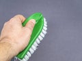 Garment brush with white bristles in hand Royalty Free Stock Photo