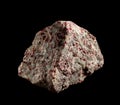 Garnet almandine crystal blotches inside rock. A mineral isolated on black. Found near Miass city, Ural, Russia. Geology