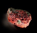 Garnet almandine stone crystal inside rock. A mineral isolated on black. Found near Miass city, Ural, Russia. Geology Royalty Free Stock Photo