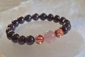 garnet beads bracelet with Hematoid In Quartz and strawberry quartz. Royalty Free Stock Photo