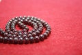Garnet beads on a red felt background