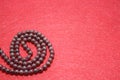 Garnet beads on a red felt background Royalty Free Stock Photo