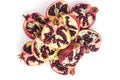 Garnet fruits cut on two isolated on white background top view. Halves of pomegranate fruits close up. Fresh, ripe garnets.