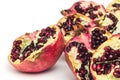 Garnet fruits cut on two isolated on white background top view. Halves of pomegranate fruits close up. Fresh, ripe garnets.