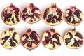 Garnet fruits cut on two isolated on white background top view. Halves of pomegranate fruits close up. Fresh, ripe garnets.
