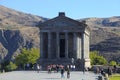 Tourists at Ancient hellenistic Garni pagan Temple in Armenia