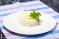 Garnish of boiled long-grain rice with butter in round form. Restaurant serving in restaurant serving