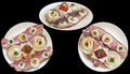 Garnished Gourmet Bacon Cheese Egg Ham and Tomato Sandwiches on White Porcelain Plates on Black Background