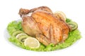 Garnished roasted thanksgiving chicken on a plate decorated with