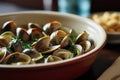 Close-up of steamed clams, linguini and parsley served in casserole