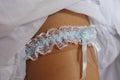 Garter on bride`s leg Royalty Free Stock Photo