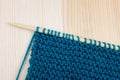 Garter stitch in teal yarn on knitting needle Royalty Free Stock Photo