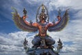 Garuda statue on sunset sky background