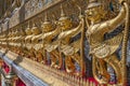 Garudas and nagas on external decorations of the Ubosoth, Wat Phra Kaew temple, Grand Palace, Bangkok, Thailand Royalty Free Stock Photo
